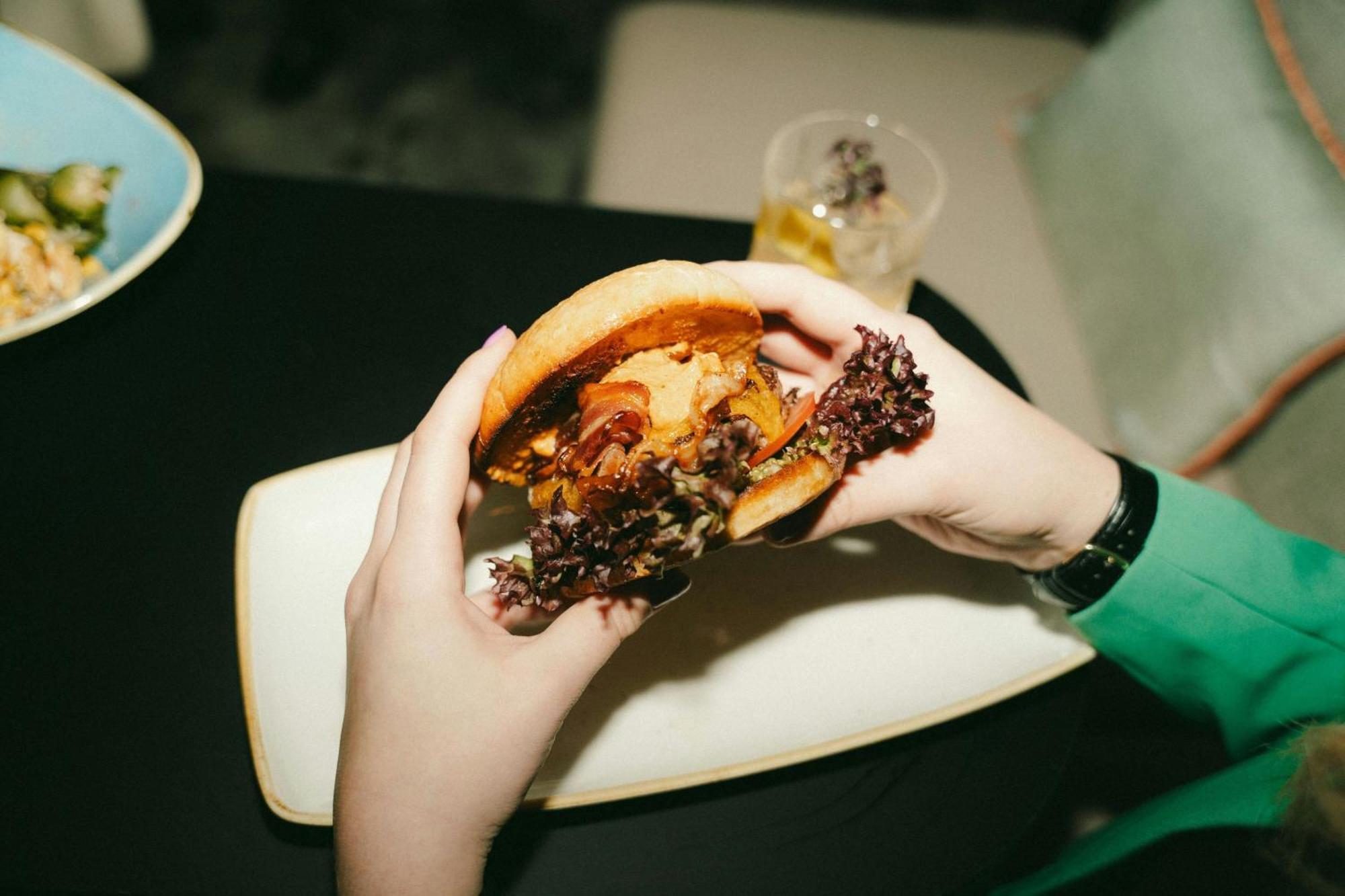 Renaissance Hamburg Hotel Exterior photo A burger being held in the hand